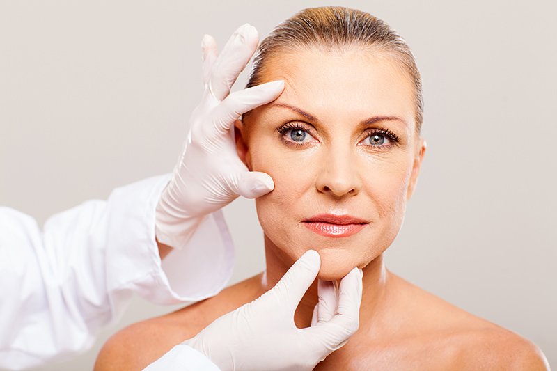 woman receiving facial examination